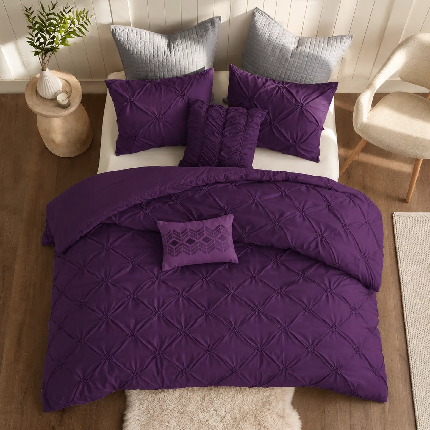 Plum Diamond Pintuck Duvet Cover Set with an all-over gathered pattern on a bed