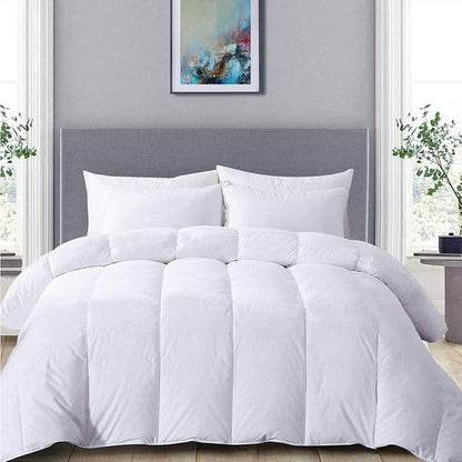White quilted 10.5 tog duvet with soft-touch cotton cover styled on a bed in a grey headboard bedroom