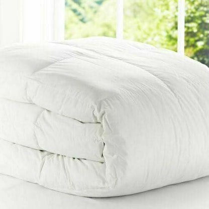 Folded white 15 tog duvet with soft-touch cotton cover, showing its thick quilted loft