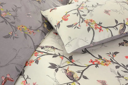 Close-up of cream Caramel Flower bedding with birds on blossom branches