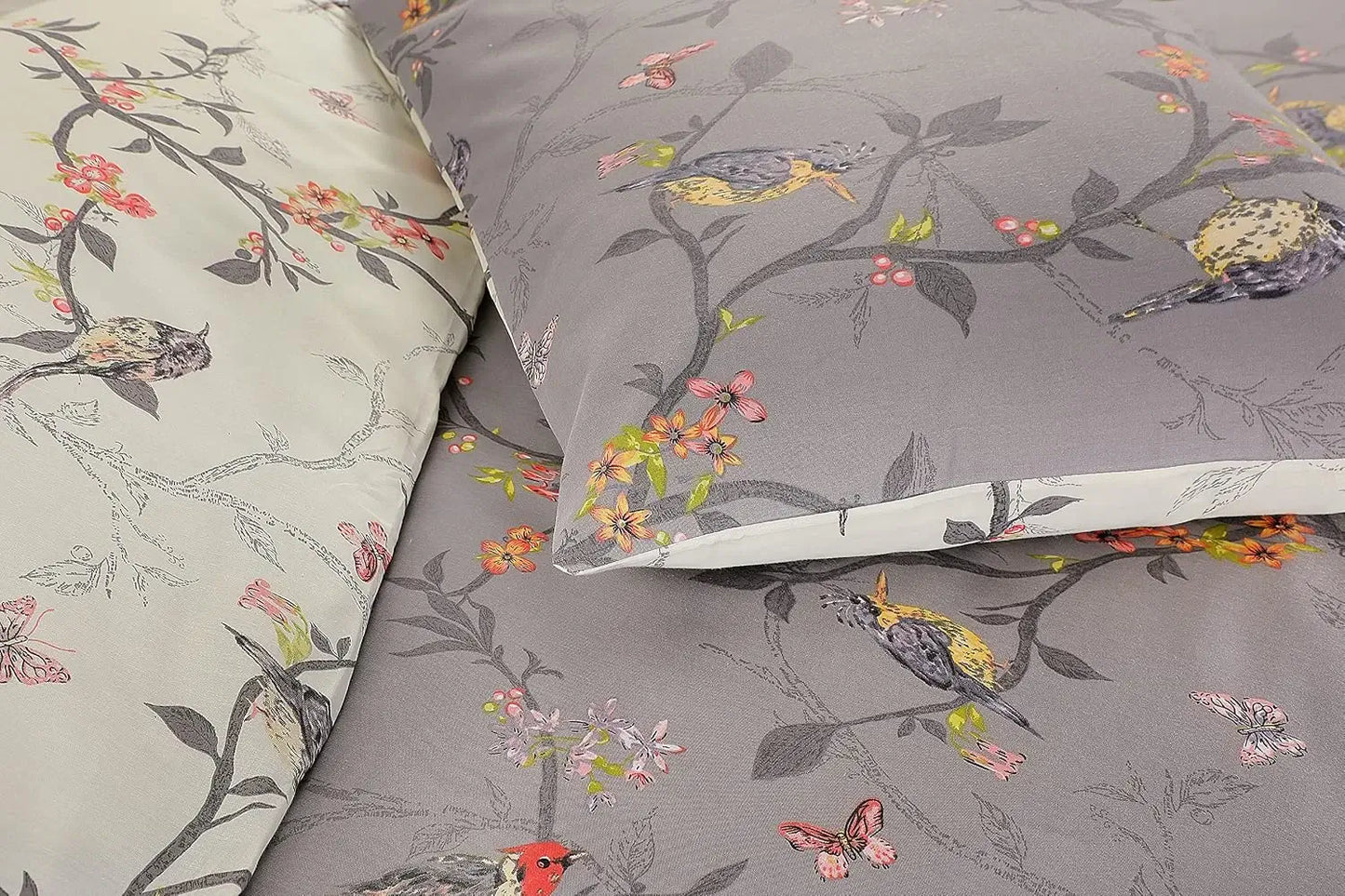 Close-up of grey bird print duvet cover showing songbirds and coral flower detail