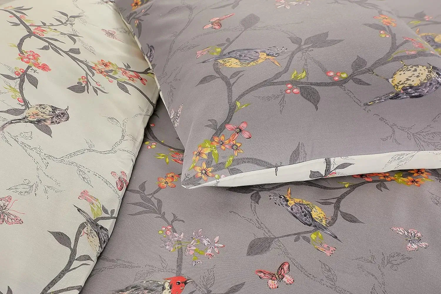 Close-up of grey bird print duvet cover showing songbirds and coral flower detail