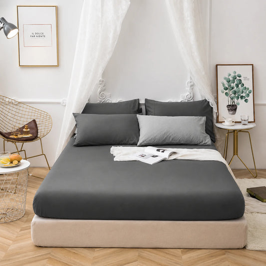 Charcoal Grey 200 thread count 30cm deep fitted sheet on a bed