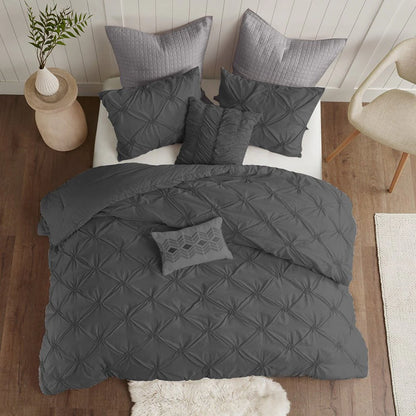 Charcoal pintuck duvet cover set styled on a contemporary bed