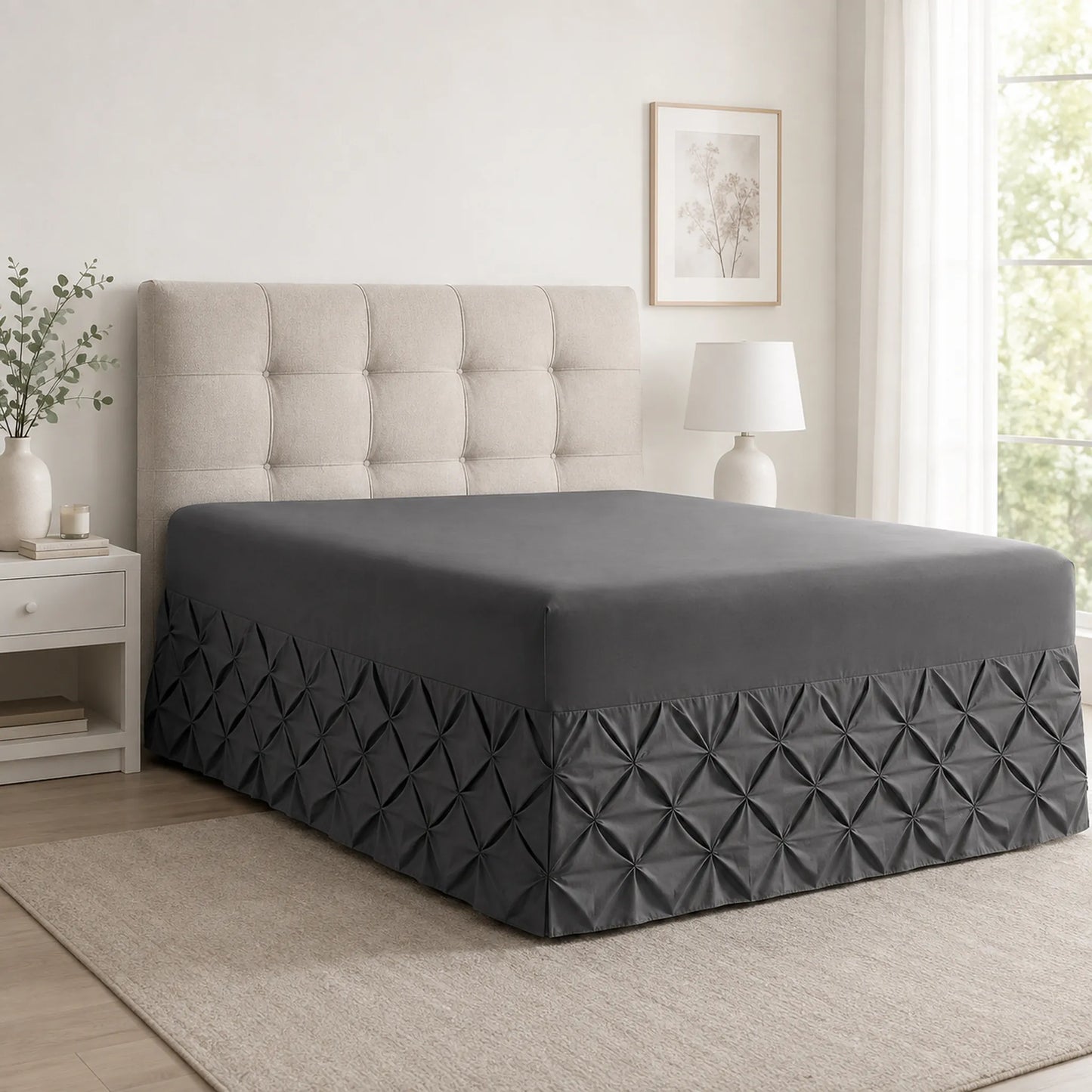 Charcoal pintuck fitted valance sheet on a bed