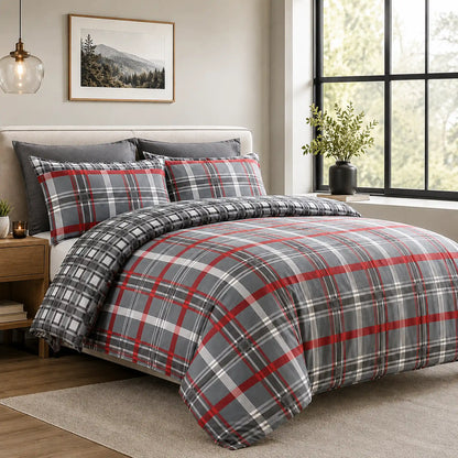 Red and charcoal tartan check duvet cover set styled on a bed