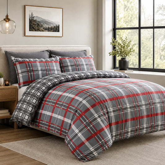 Red and charcoal tartan check duvet cover set styled on a bed