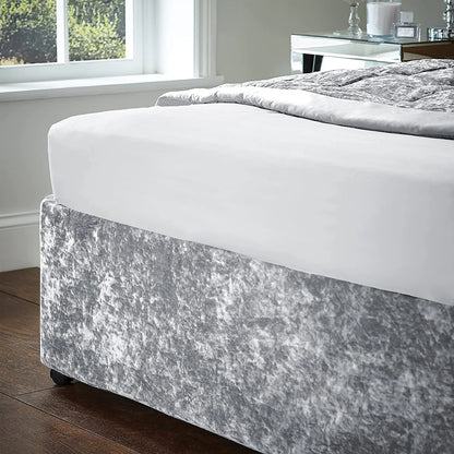 Close-up of crushed velvet divan base cover fitted snugly over base corner