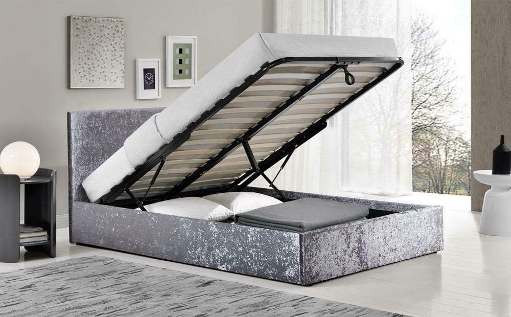 Divan base with ottoman storage lifted open, showing under-bed storage space