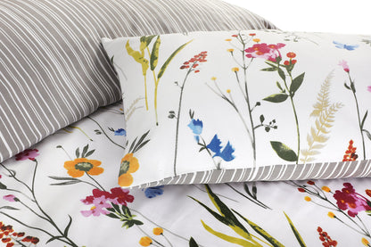 Close-up of floral duvet cover set showing flower print and grey striped pillowcase