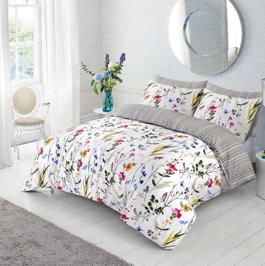 Floral duvet cover set with colourful wildflower and butterfly print styled on a bed