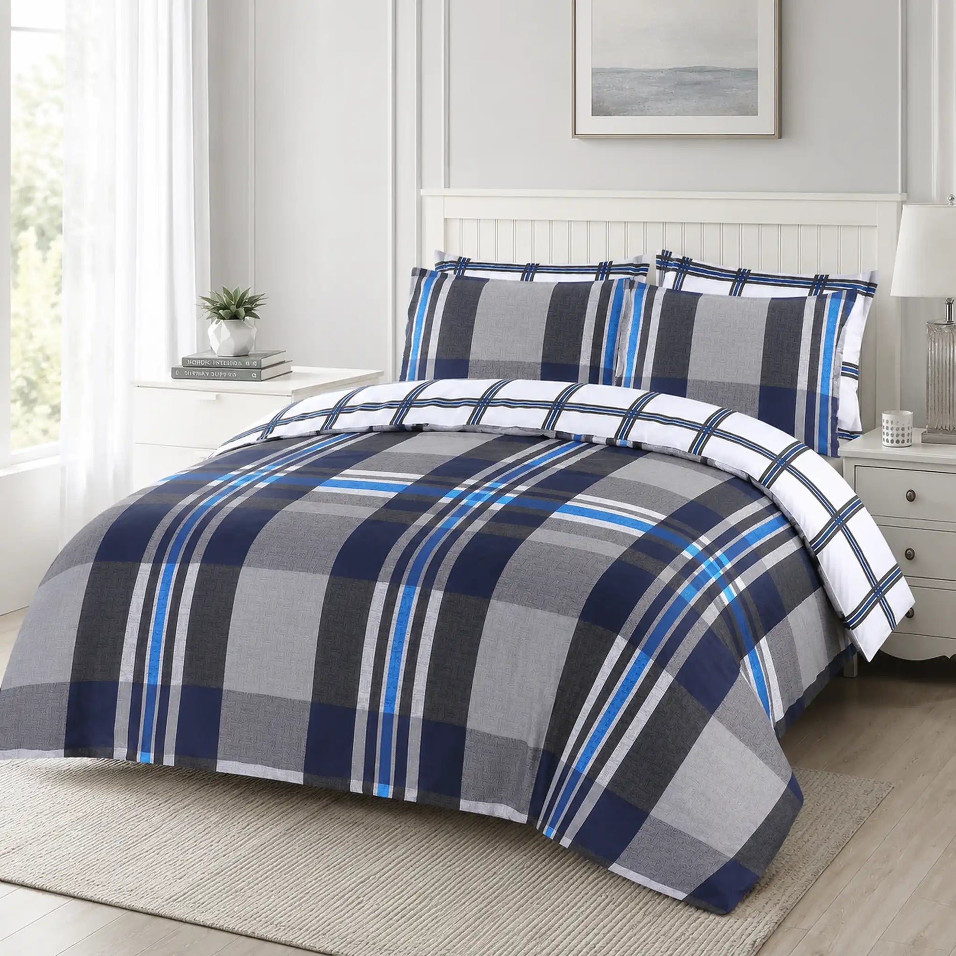 Gingham duvet cover set with bold navy, grey and blue check styled on a bed