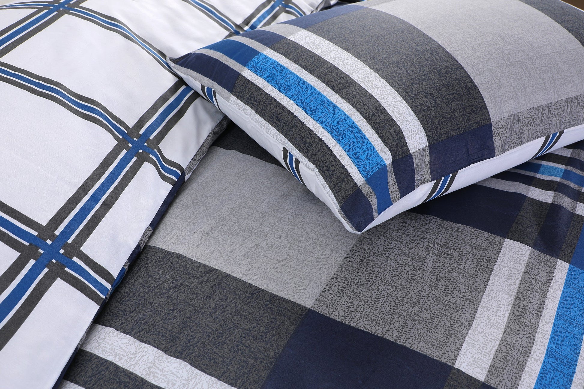 Close-up of navy, grey and blue check duvet cover set showing fabric detail