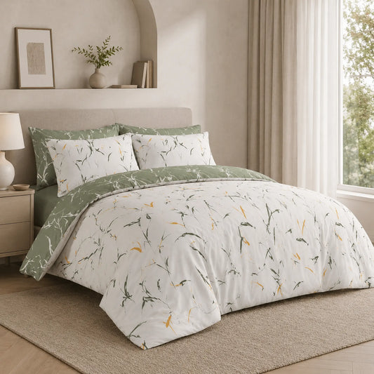 Sage green and white botanical duvet cover set with leaf print, reversible green side folded back