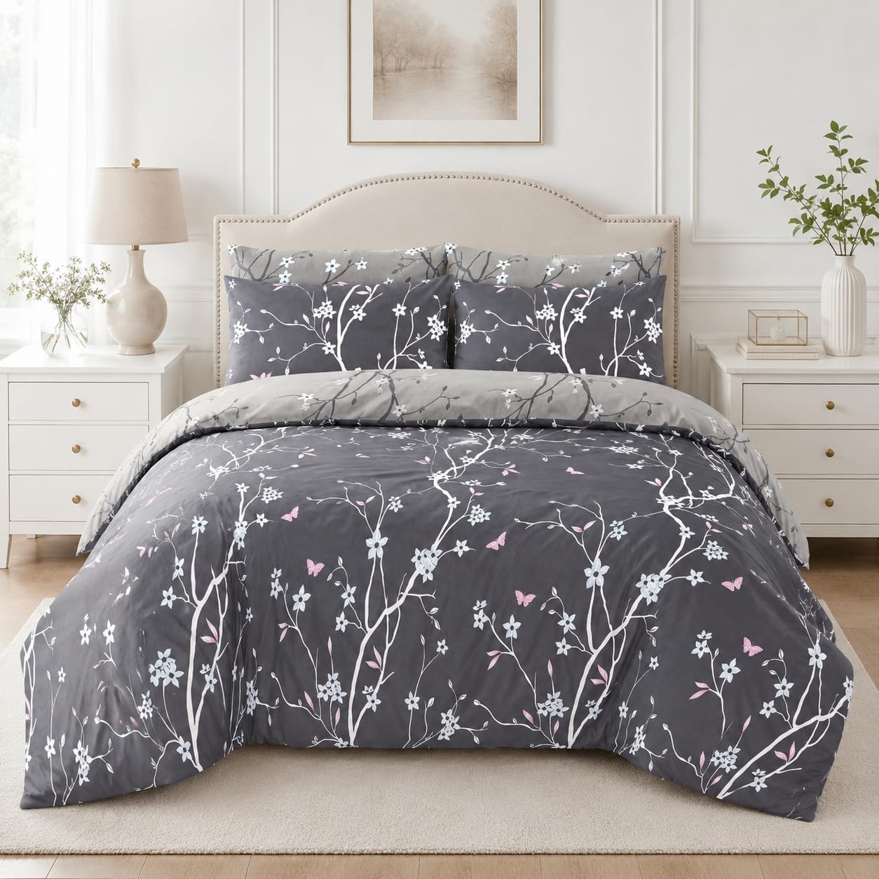 Grey duvet cover set with white floral branch print styled on a bed