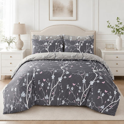 Grey duvet cover set with white floral branch print styled on a bed