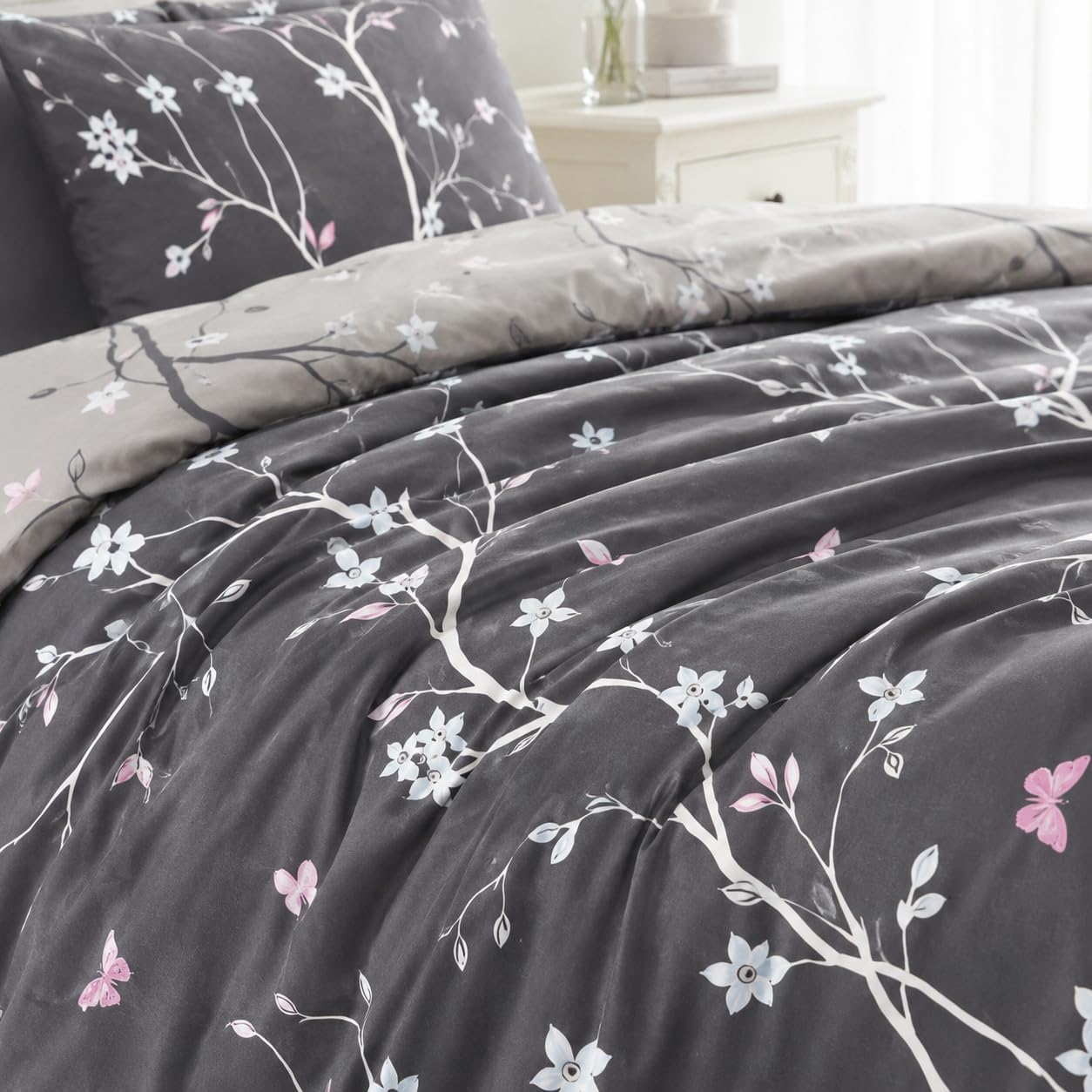 Close-up of grey brushed microfibre fabric with white floral print