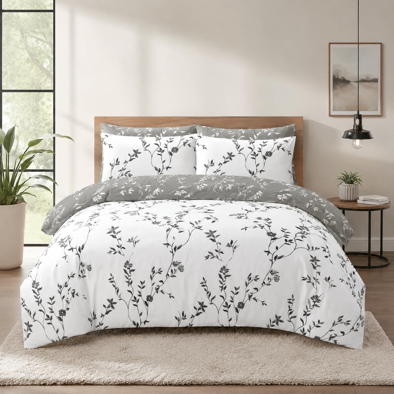 Grey floral duvet cover set showing the reversible white side with grey vine print