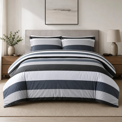 Grey, black and white striped duvet cover set styled on a bed