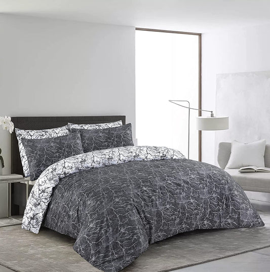 Charcoal and black marble print duvet cover set styled on a bed
