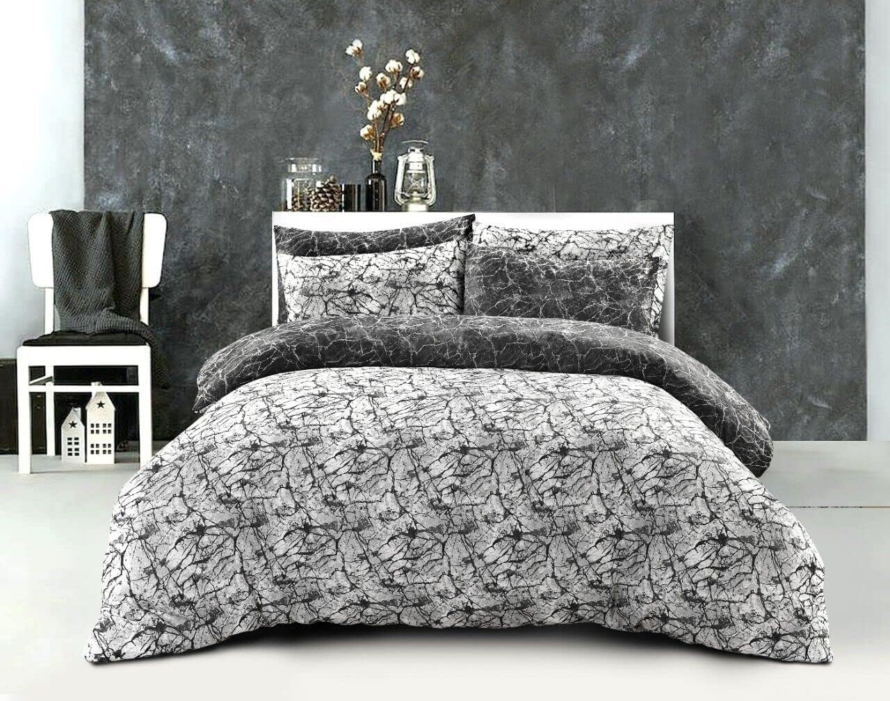 Grey and white marble print duvet cover set styled on a bed