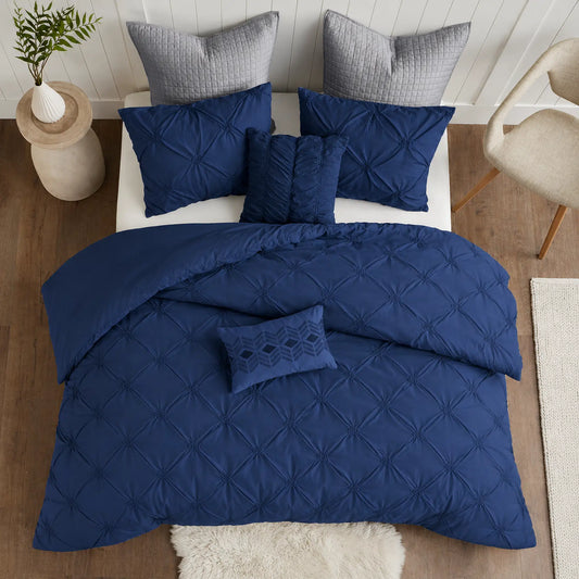 Navy Diamond Pintuck Duvet Cover Set with an all-over gathered pattern on a bed
