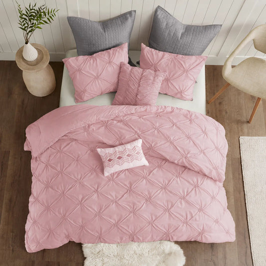 Pink Diamond Pintuck Duvet Cover Set with an all-over gathered pattern on a bed