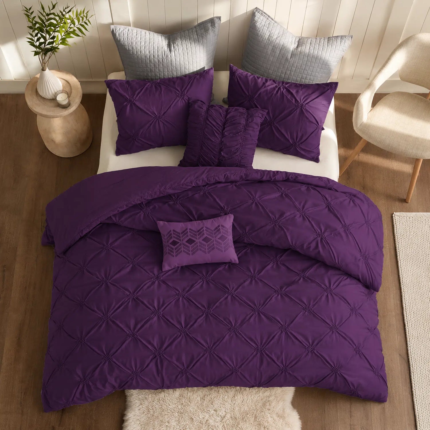 Plum Diamond Pintuck Duvet Cover Set with an all-over gathered pattern on a bed