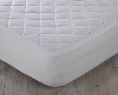 Quilted mattress protector fitted securely around mattress corner