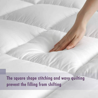 Quilted single mattress topper with box stitching to keep filling evenly spread