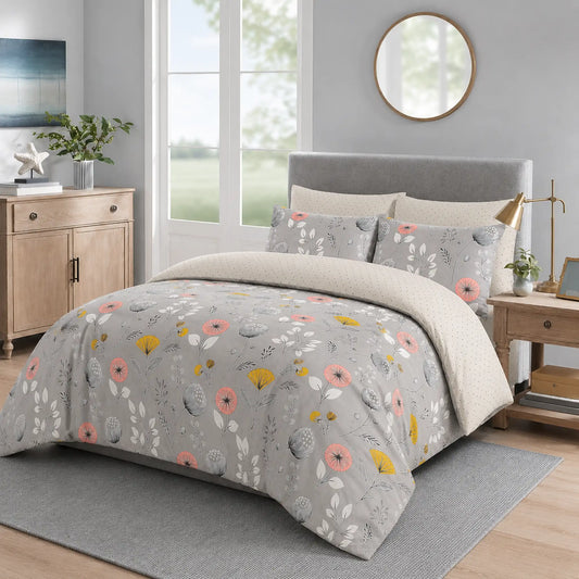 Grey duvet cover set with pink, yellow and white wildflower print styled on a bed