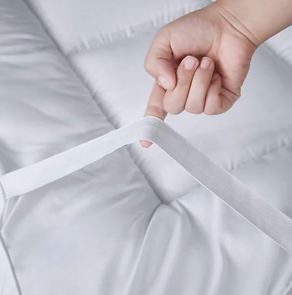 Elasticated strap detail on small double mattress topper