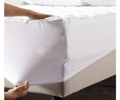 Waterproof quilted mattress protector shown in bedroom and nursery settings
