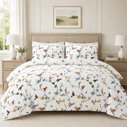 Flat lay of white floral duvet cover set showing both the floral and grey lattice reversible sides