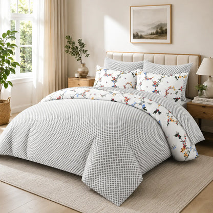 White floral duvet cover set showing the reversible grey lattice pattern side