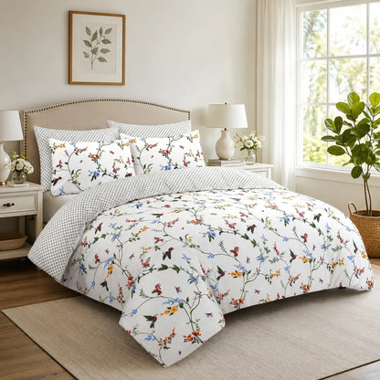 White floral duvet cover set with hummingbird and butterfly print styled on a bed
