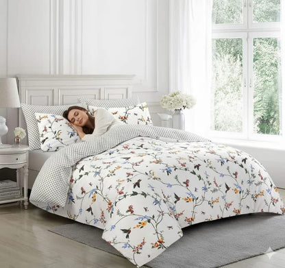 Woman sleeping on white floral duvet cover set with hummingbird print