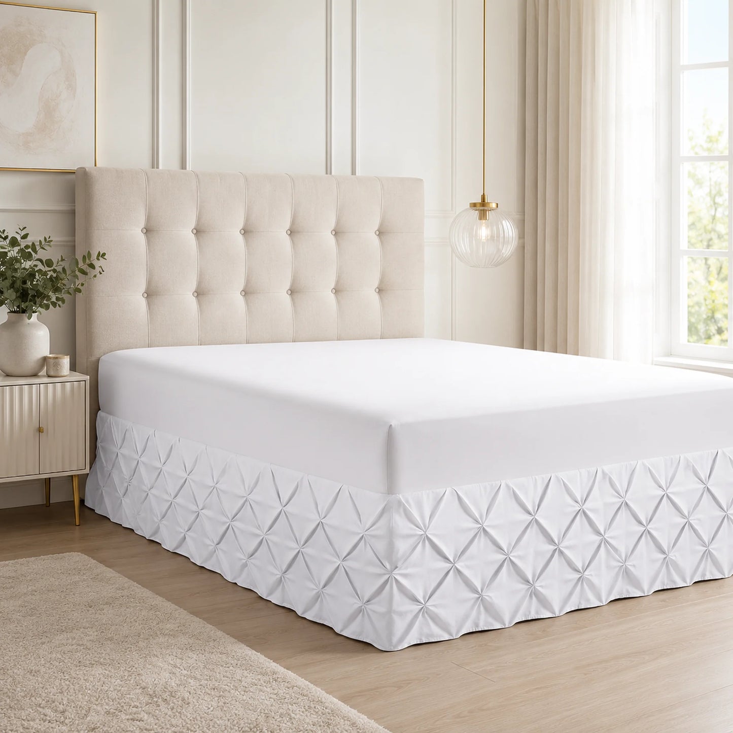 White pintuck fitted valance sheet on a bed