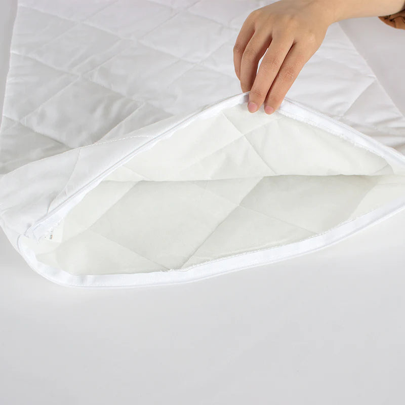Zipped waterproof quilted pillow protector with open closure detail